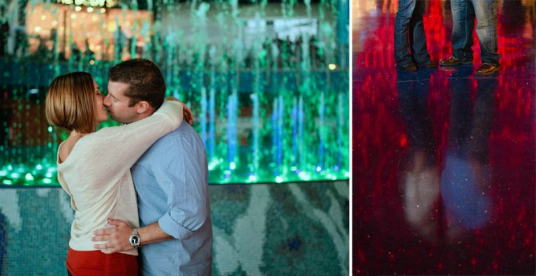 couple kisses in front of fountain in atlantic city nj during their engagement photo session with their wedding photographers