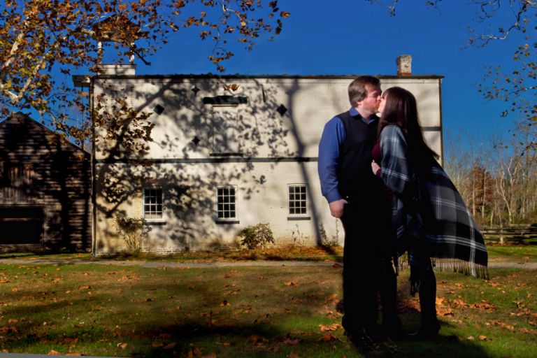 couple kisses during their photo session at Allaire State Park in NJ for wedding photographers Markow Photography
