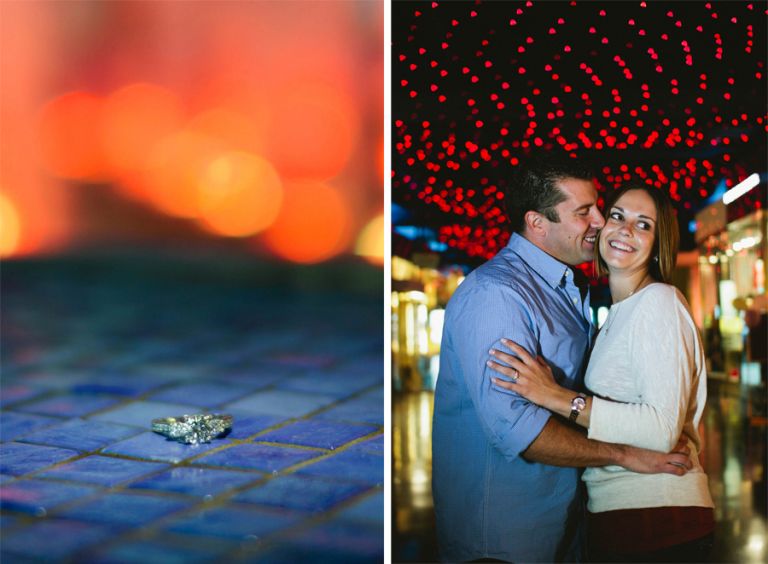 couple embraces under lights in atlantic city nj during their engagement photo session with their wedding photographers markow photography