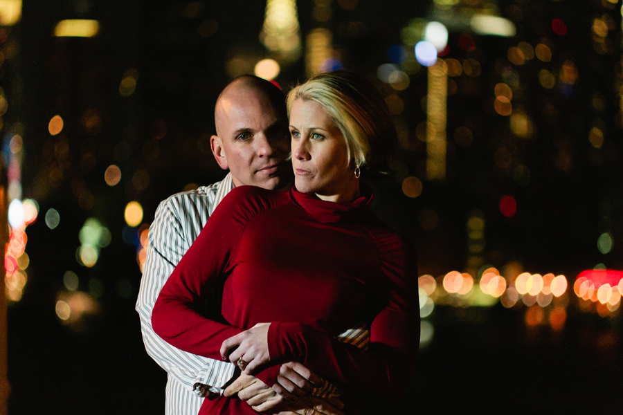 Couple poses in front of NYC skyling during their engagement photo session with their monmouth county nj wedding photographers markow photography