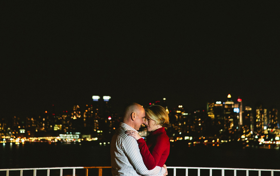 Couple poses in front of NYC skyling during their engagement photo session with their monmouth county nj wedding photographers markow photography
