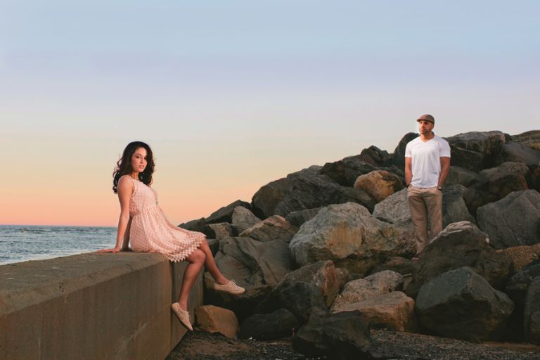 Couple poses at Point Pleasant inlet during their engagement photo session with their monmouth county nj wedding photographers markow photography