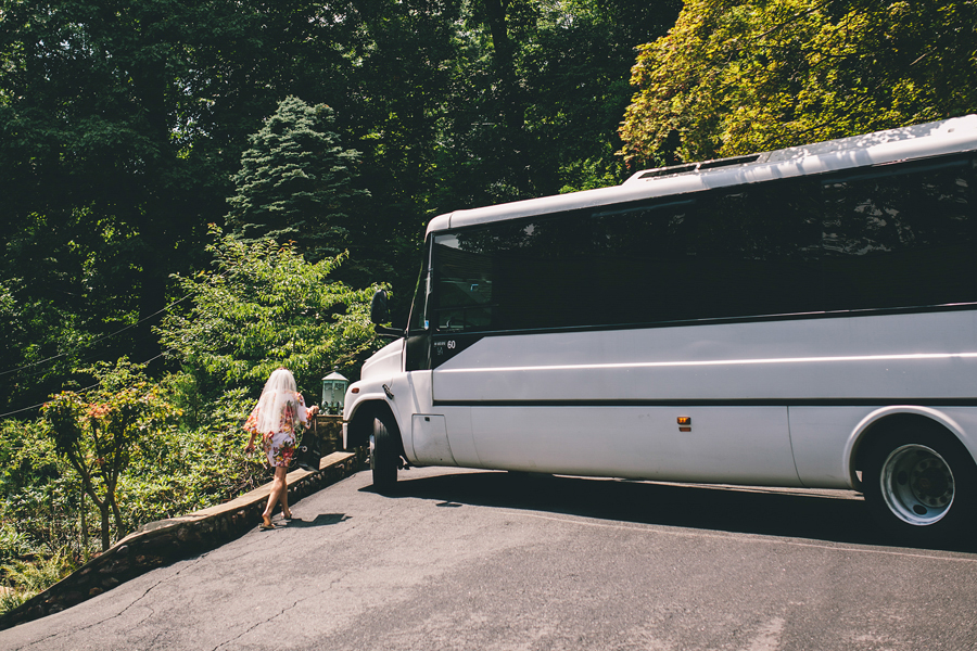 Bride getting on party bus