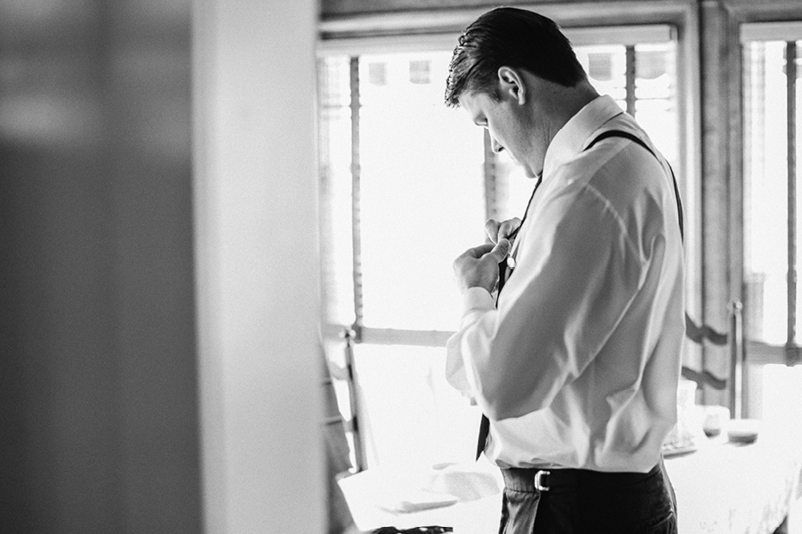 creative groom getting ready photo
