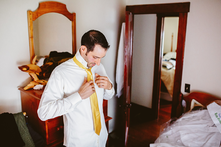 Groom getting read at Fiddle Lake Farm Lake House 
