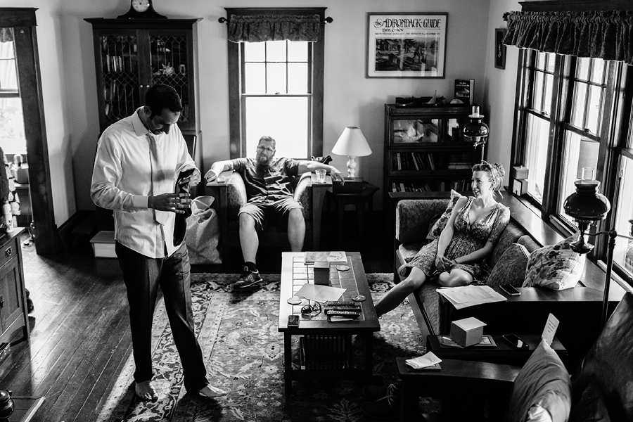 Groom getting read at Fiddle Lake Farm Lake House
