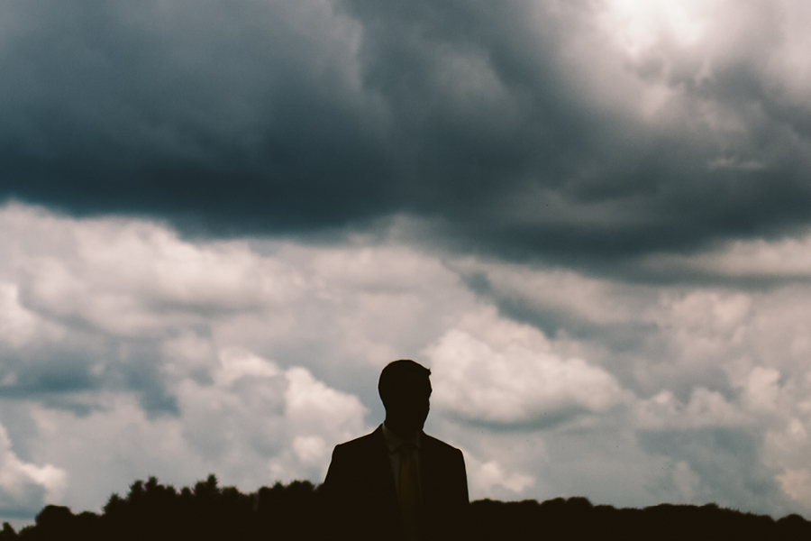 creative groom portrait at Fiddle Lake Farm