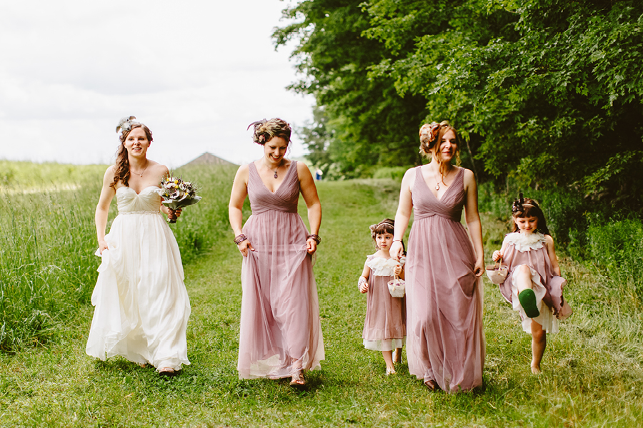Bride walking to ceremony fiddle lake farm