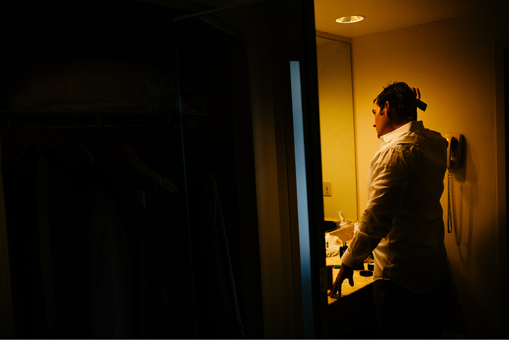 groom getting ready in hotel nj