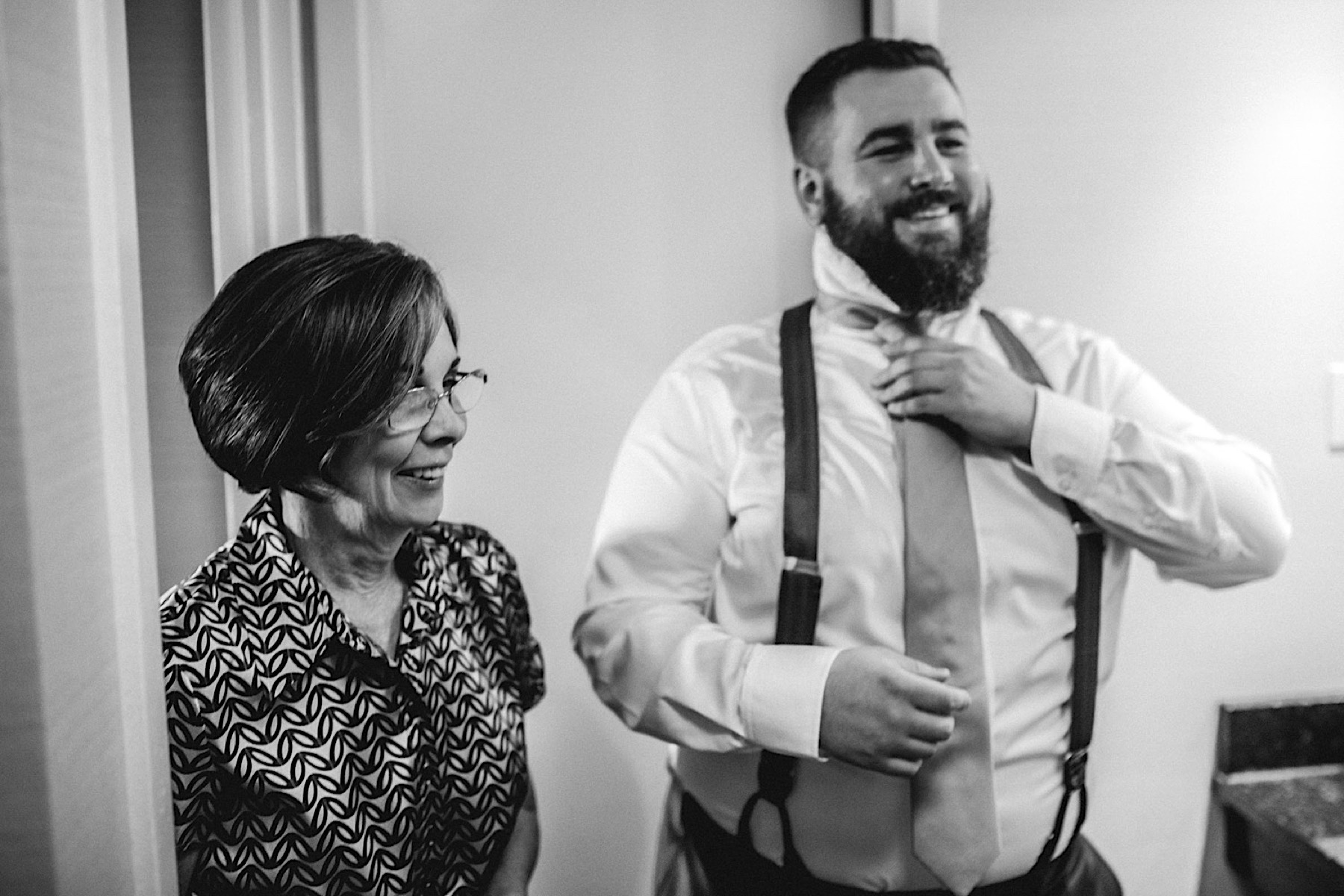 black and white groom with mom