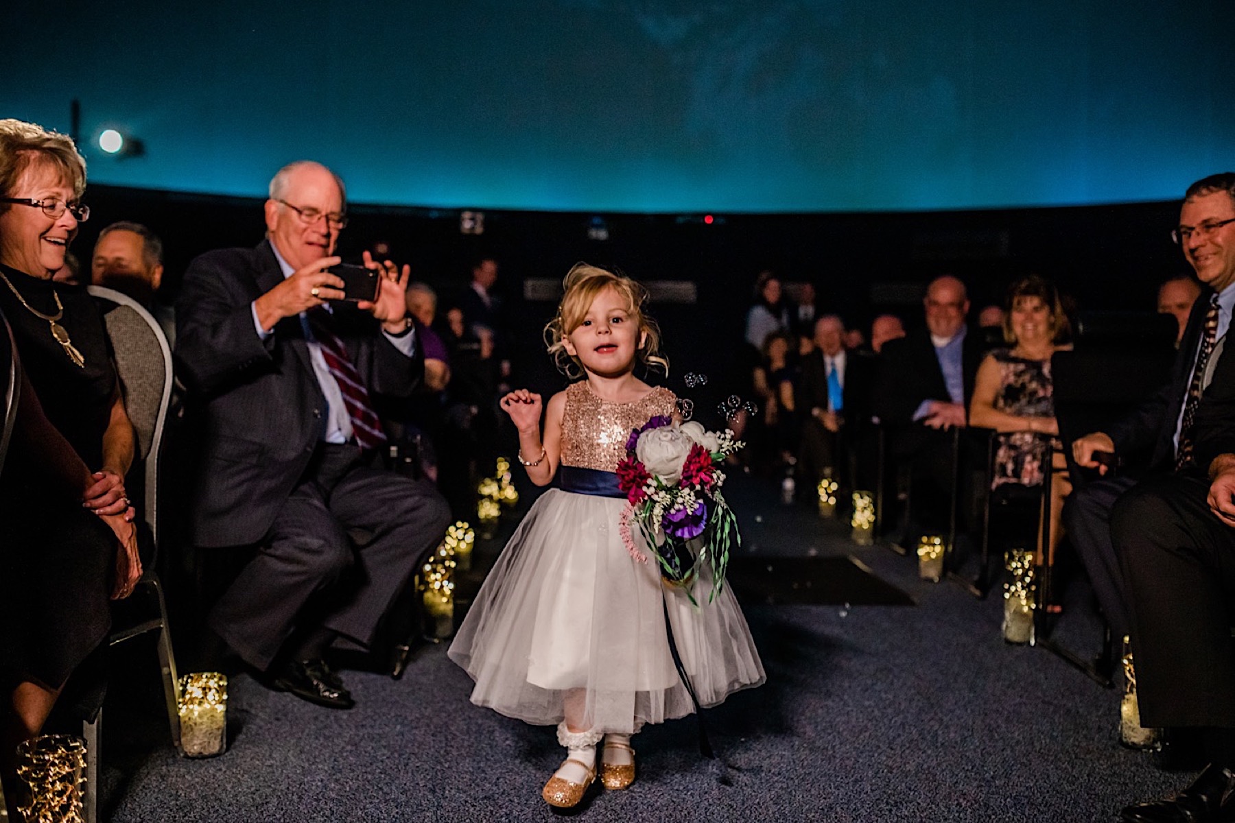 flower girl at planetarium wedding ceremony