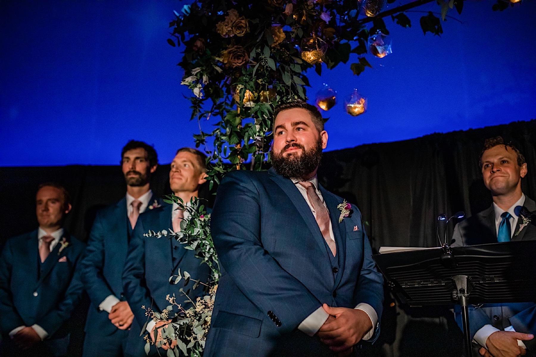 groom at planetarium wedding ceremony